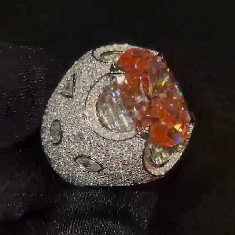 Kiss The Ring Of A Moissanite Spessartine Oval Ring